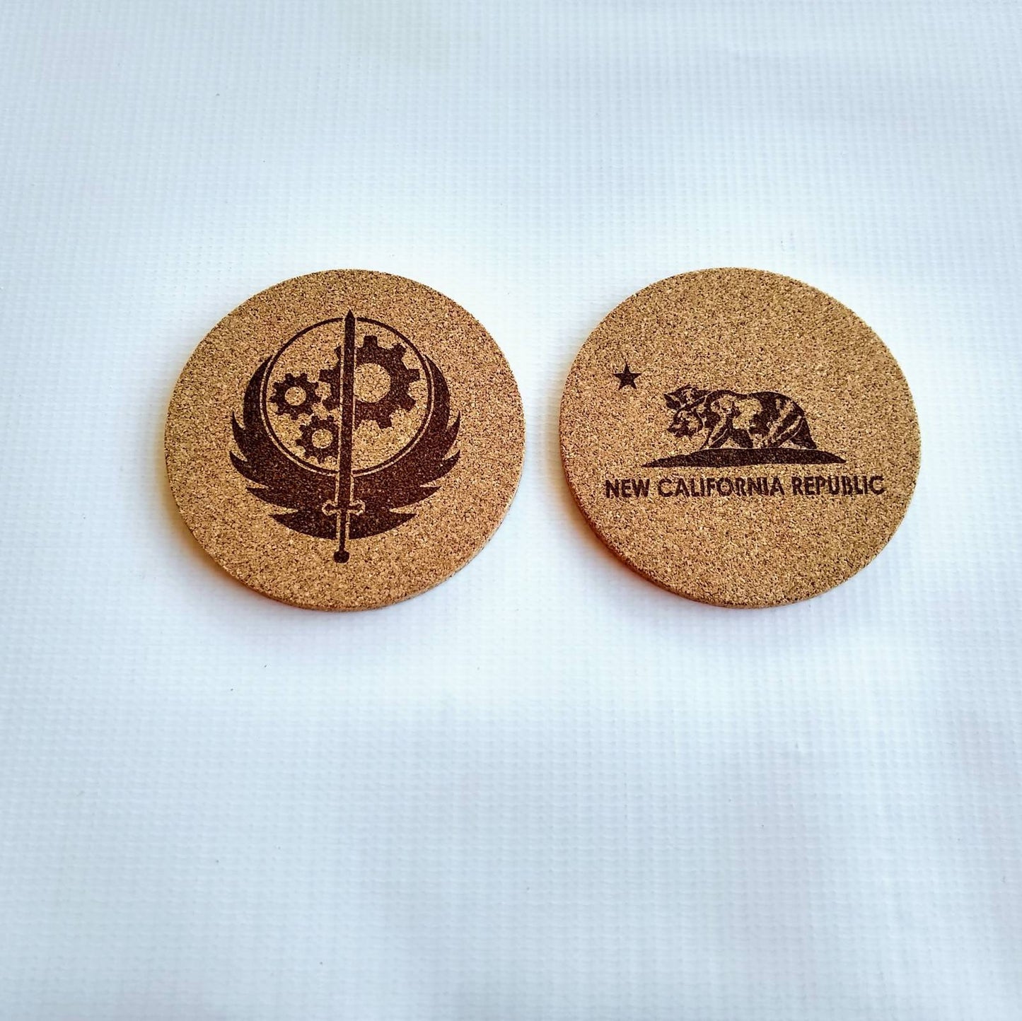 Fallout Game 4 inch Round Cork Coasters, with Brotherhood of Steel and NCR symbol.