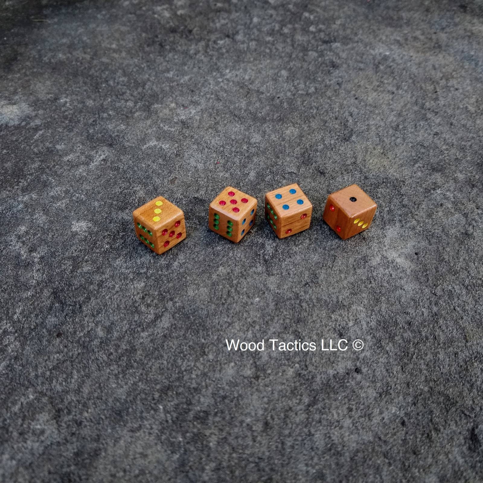 Custom Inked d6 Pip dice made from Cherry. Ink Colors are Blue, Red, Yellow,Green, Black, Orange