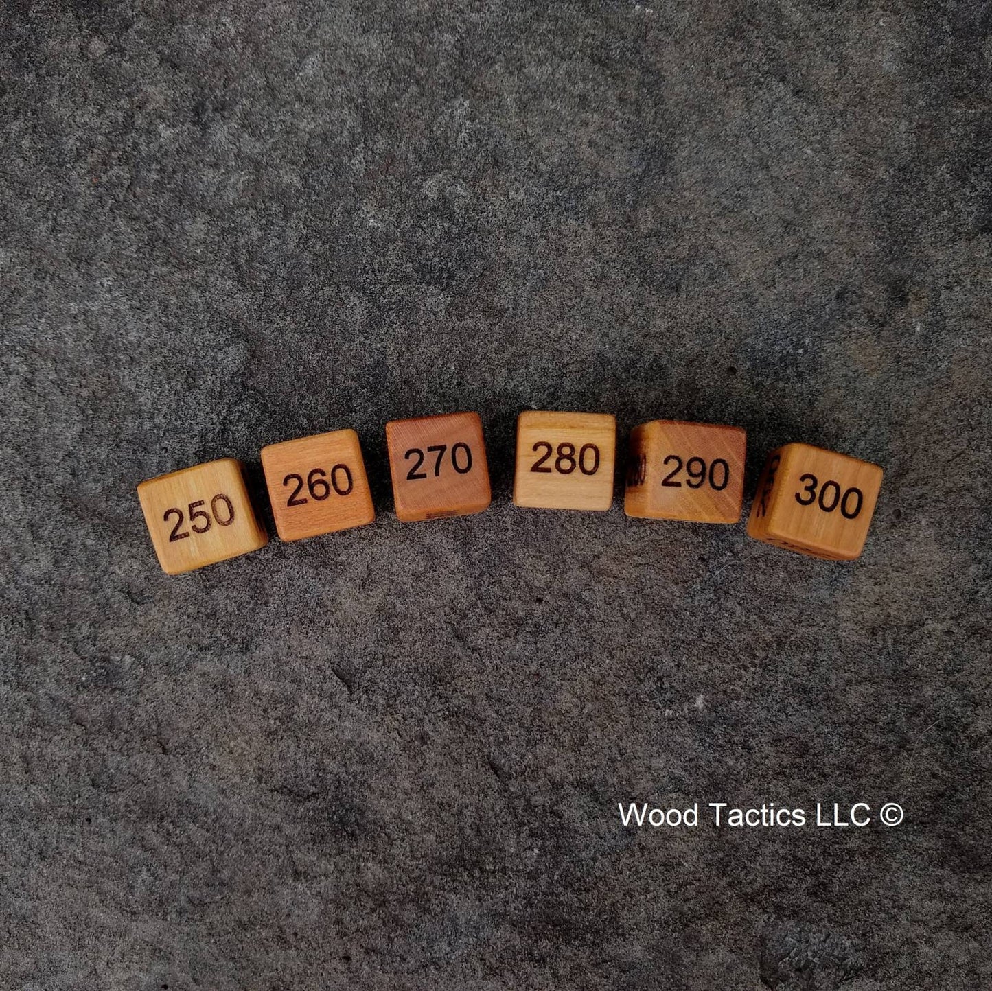 D6 Damage Counter Dice for Pokémon TCG made from Variegated Cherry Hardwood, Counting in the 10's going from 300 to 250