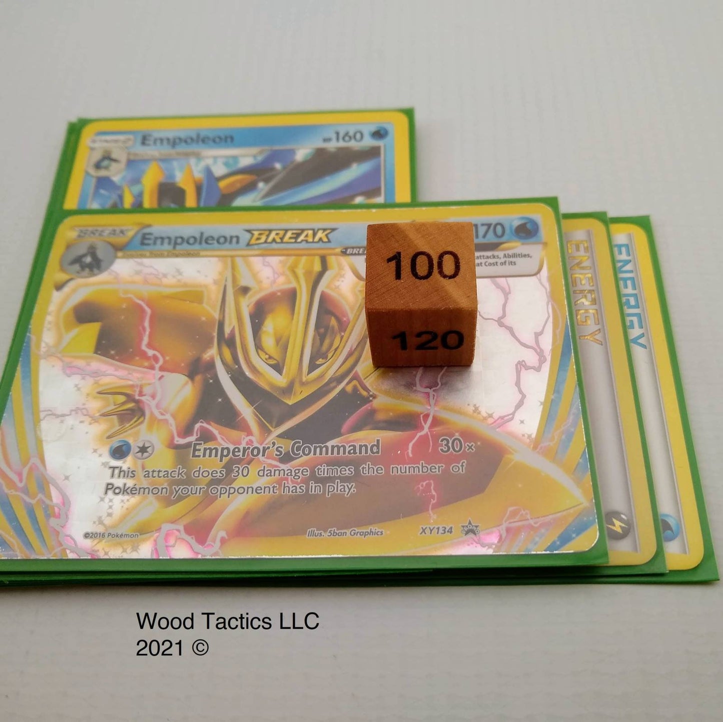 D6 Damage Counter Dice for Pokémon TCG made from Variegated Cherry Hardwood, Size Example on TCG Card