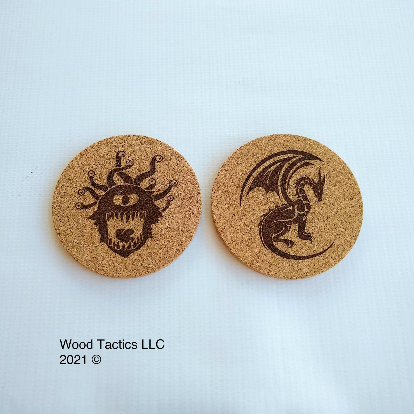 Dungeons and Dragons 4 inch Round Cork Coasters with Dragon and Eye Beast.