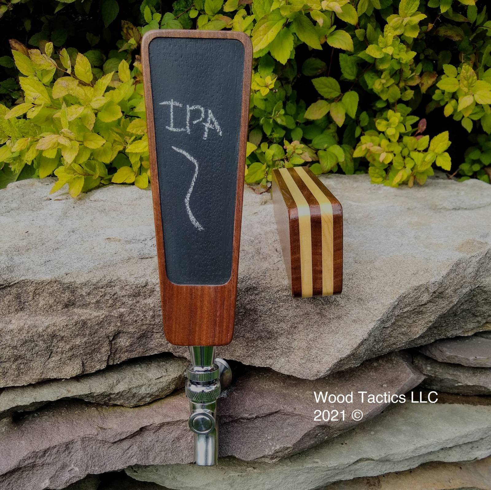 Custom Bartap made from Walnut and Maple Hardwood laminated together with a blackboard center.