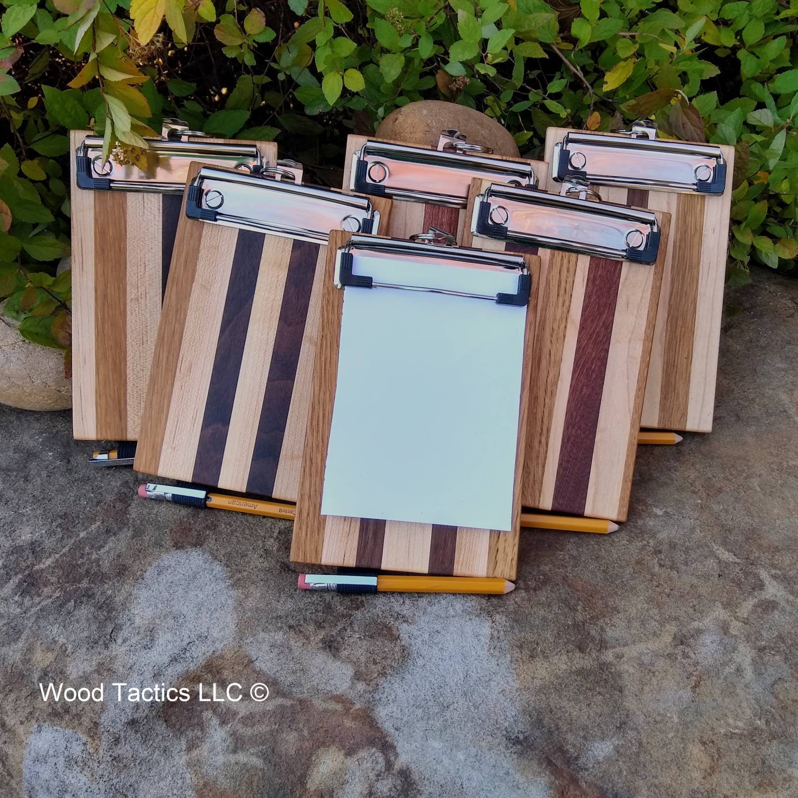 Small wood clipboards made from White Oak, Sugar Maple and Walnut and made from White Oak, Sugar Maple and Sapele.
