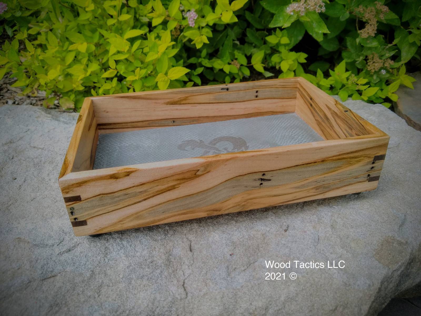 Custom Dice Tray made from Ambrosia Maple and Walnut splines, with a grey leather interior with DnD logo.