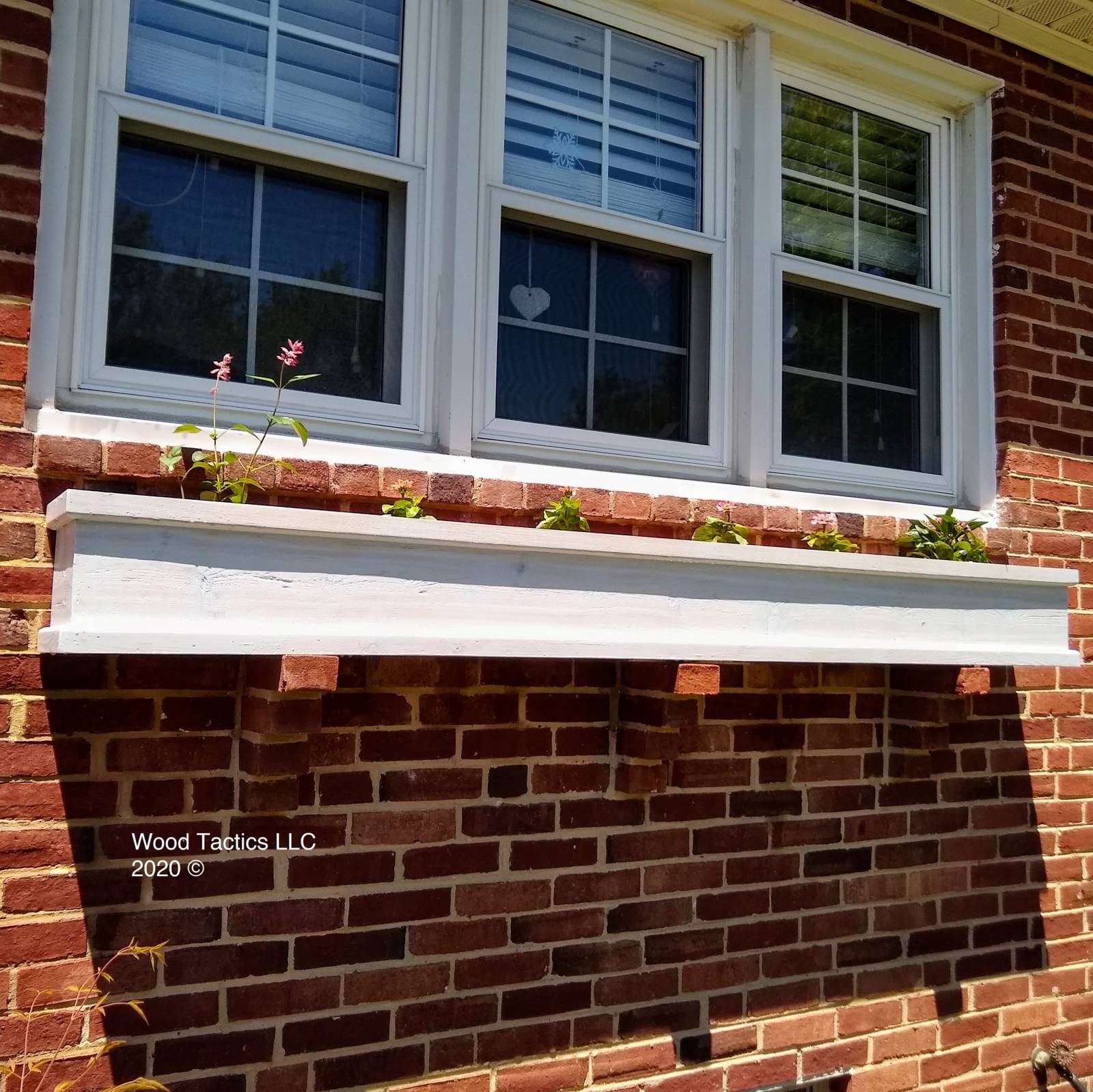 Custom Comissioned Planter box for window ledge made from Cedar with a grey stain.