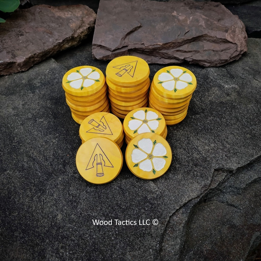 Custom 30mm round Tokens made from Maple wood and dyed yellow. Featuring inked flower and inked arrow head.