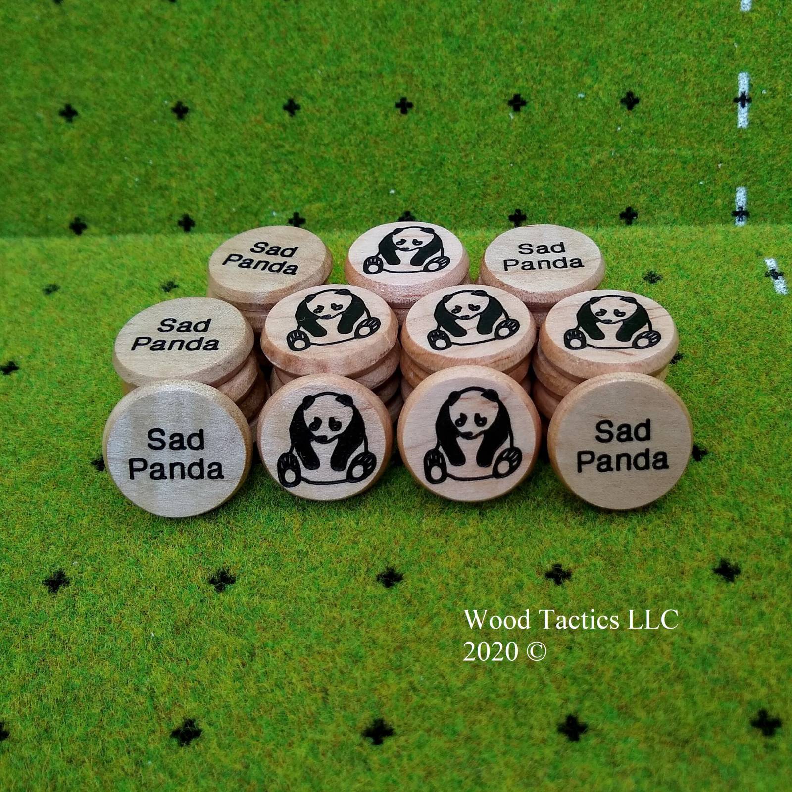 Custom 30mm Round Tokens made from Maple Hardwood featuring a Panda on One side and "Sad Panda" on the other.