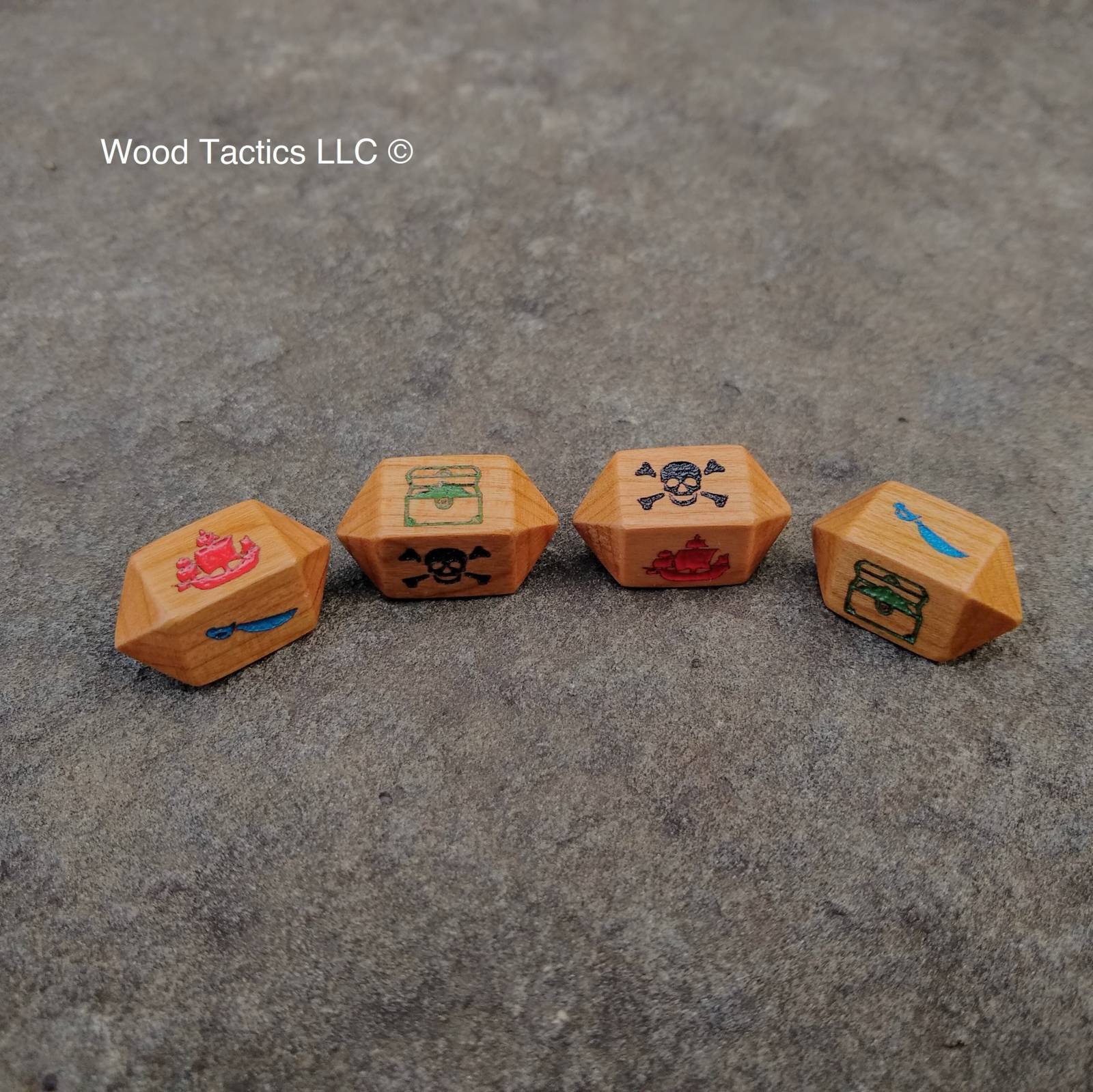 Cherry Hardwood Barrel D4 Inked dice for bluffaneer game. Symbols are Pirate Ship, Skull and Pones, Treasure Chest and Sword.