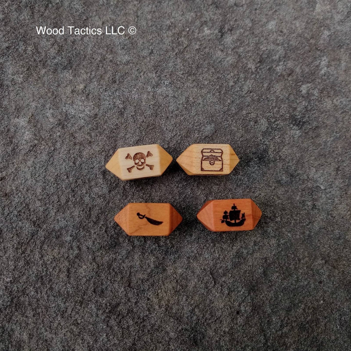 Cherry/Maple Hardwood Barrel D4 dice for bluffaneer game. Symbols are Pirate Ship, Skull and Pones, Treasure Chest and Sword.