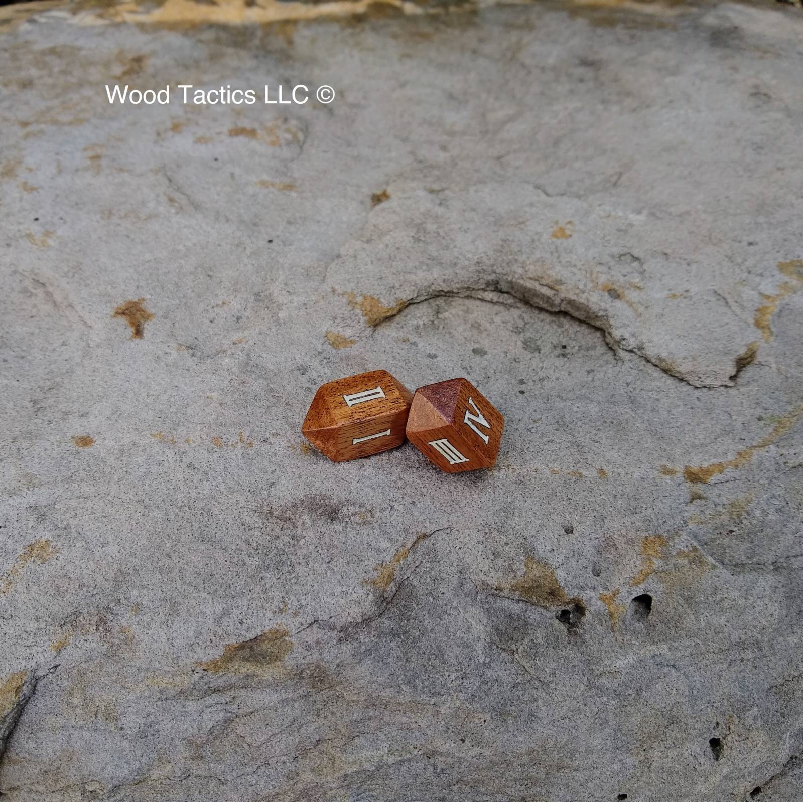 Sapele Hardwood Barrell D4 Dice with Roman Numeral Symbols.  Inked in White