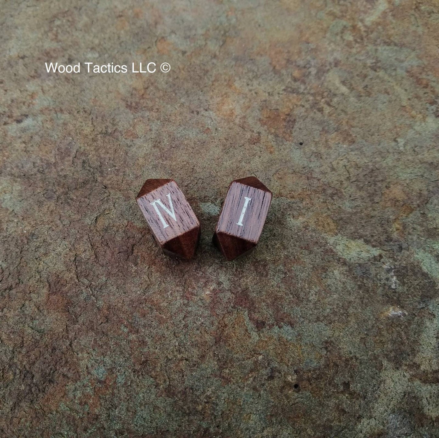 Walnut Hardwood Barrell D4 Dice with Roman Numerals Symbols. Symbols are inked in white.