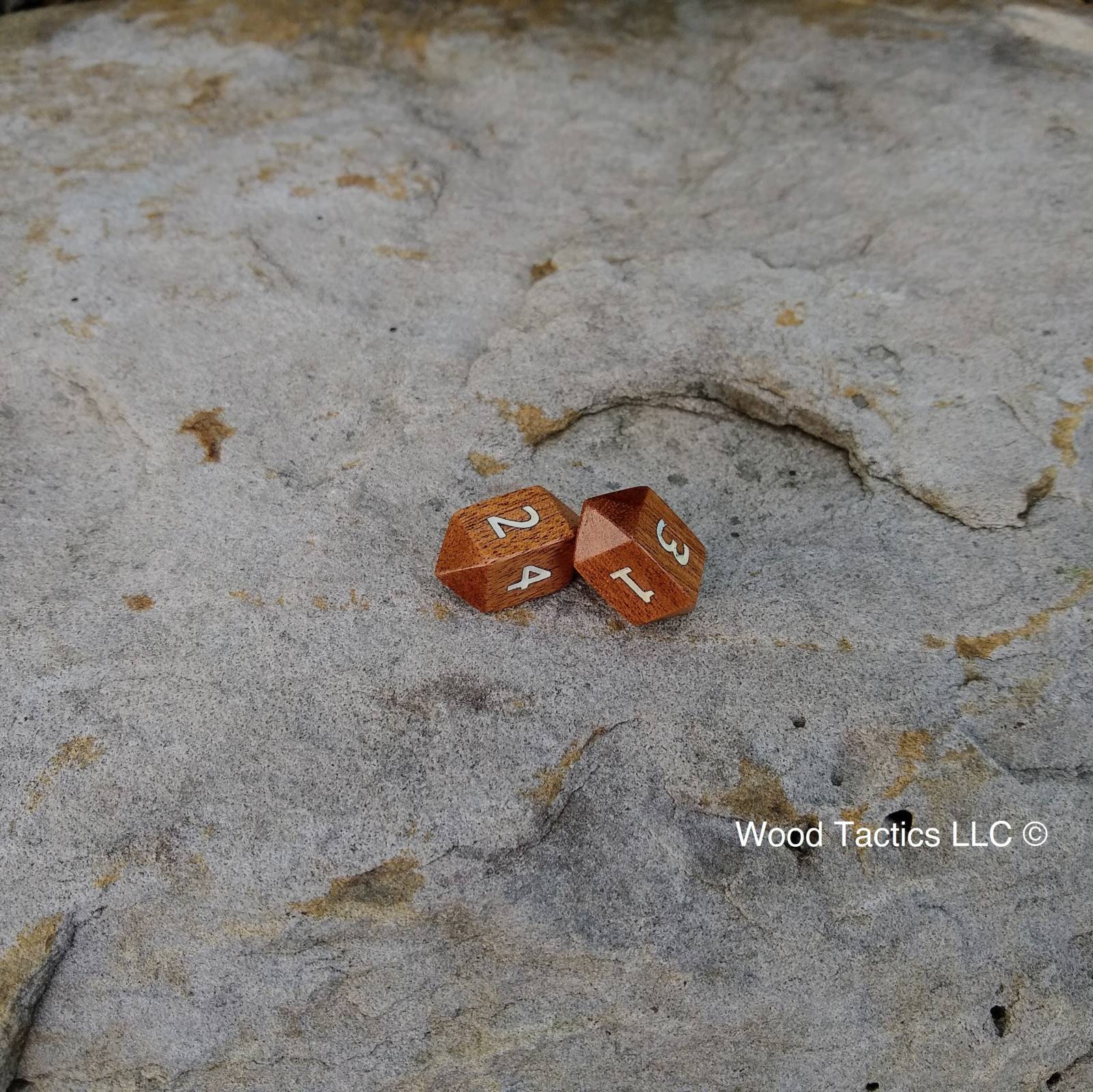 Sapele Hardwood Barrell D4 Dice with Number Symbols.  Inked in white.