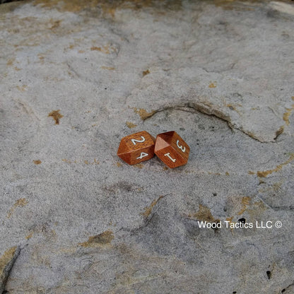 Sapele Hardwood Barrell D4 Dice with Number Symbols.  Inked in white.