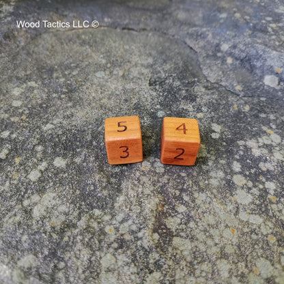Cherry Hardwood D6 16mm in size Dice with Numbers Symbols.  Face Grain View.