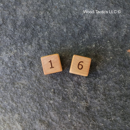 Maple Hardwood D6 16mm in size Dice with Standard Numbers. End Grain View.