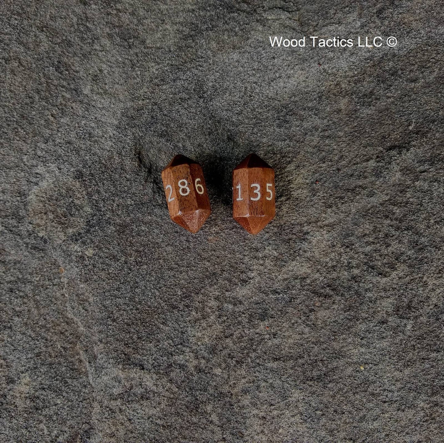 Walnut Hardwood Barrell D8 Dice with Numbers Symbols. Symbols are inked in white.
