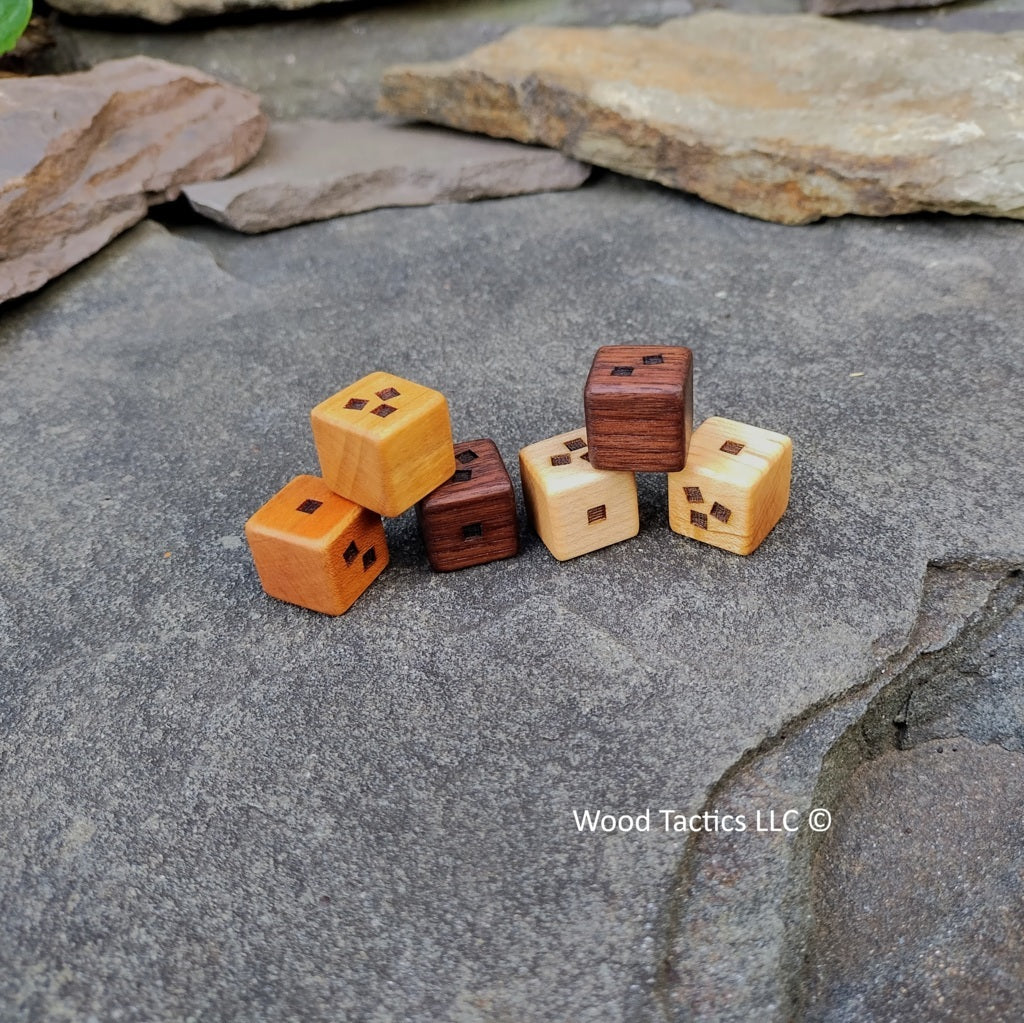 Small World Board Game dice made from various hardwoods with blank, single square, double square and triple square sides.