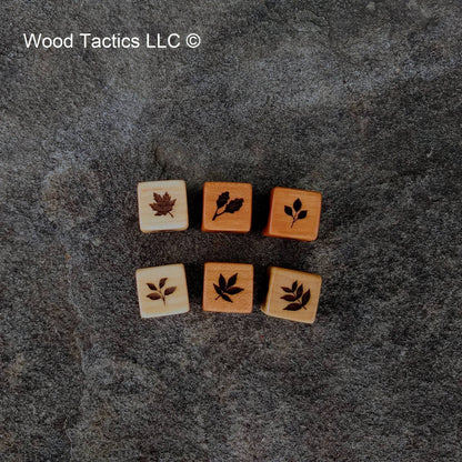Hardwood d6 dice with intricate tree leaf designs: dogwood, oak, maple, hickory, walnut & cherry leaves.