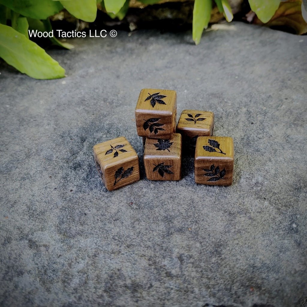 Walnut hardwood d6 dice with intricate tree leaf designs: dogwood, oak, maple, hickory, walnut & cherry leaves.