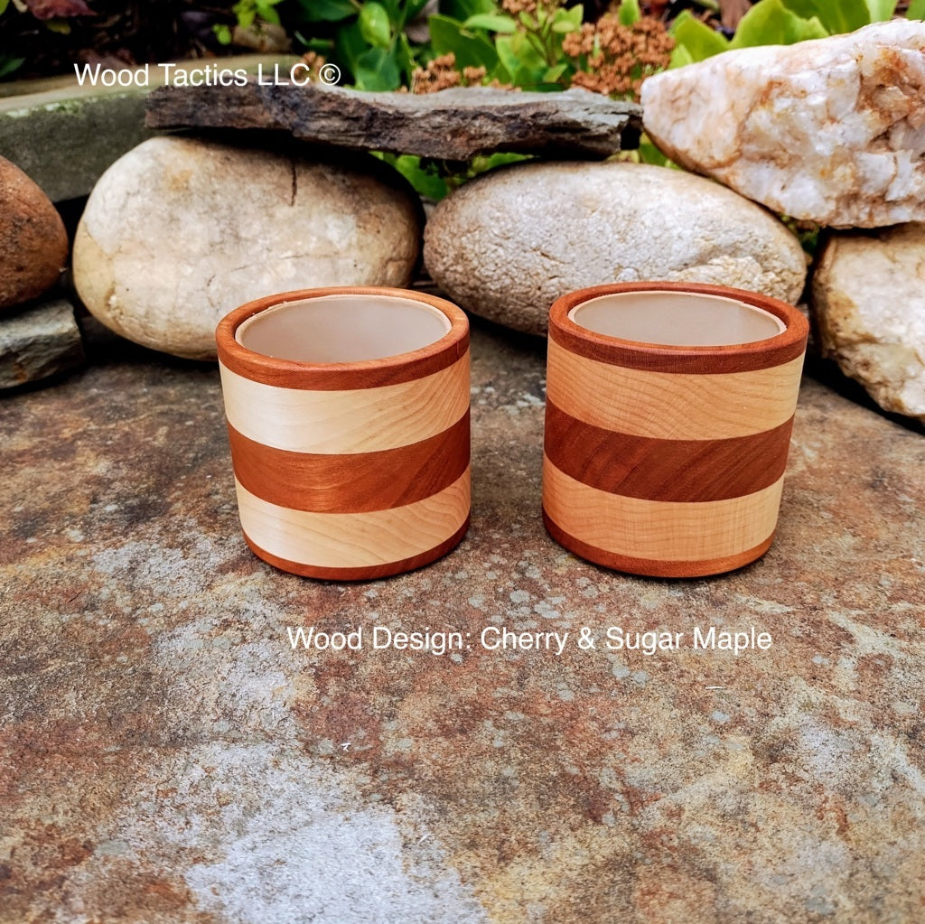 Cherry and maple wood dice cup with foam lining, featuring a sleek, striped design for quiet, cushioned rolls in style.