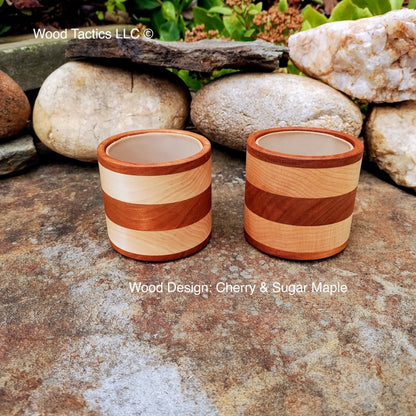 Cherry and maple wood dice cup with foam lining, featuring a sleek, striped design for quiet, cushioned rolls in style.