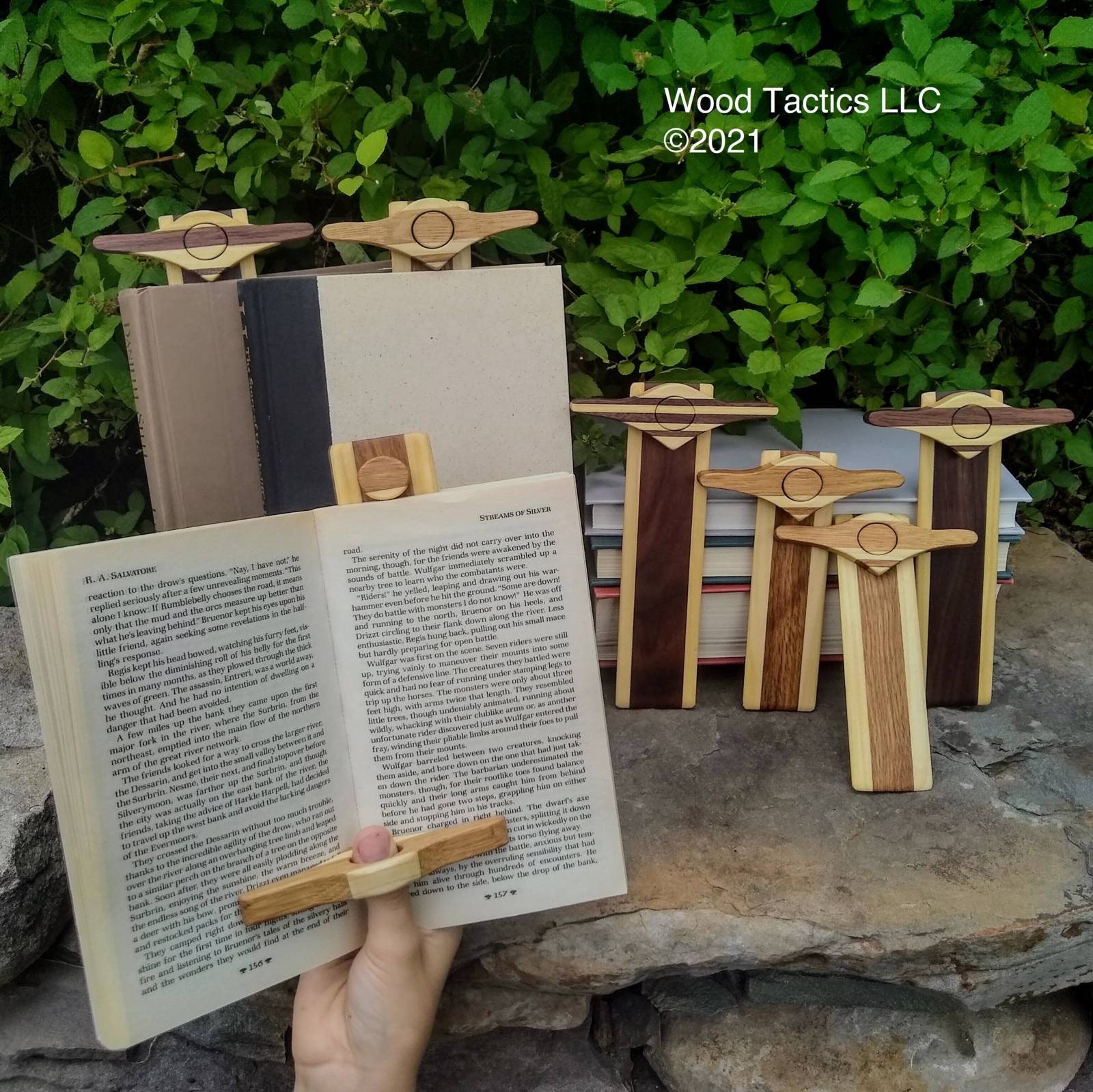 Mark&Hold: A unique bookmark with a thumb page holder, magnetic design, and made from various hardwoods with a stripped pattern.